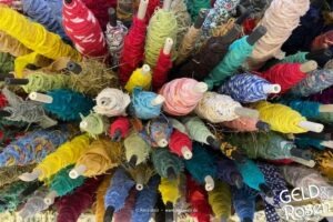 Das Bild zeigt viele Garnrollen von oben als Bildmetapher für Existenzgründung (Photocredit: Petra Welz, Geld & Rosen, Düsseldorf)